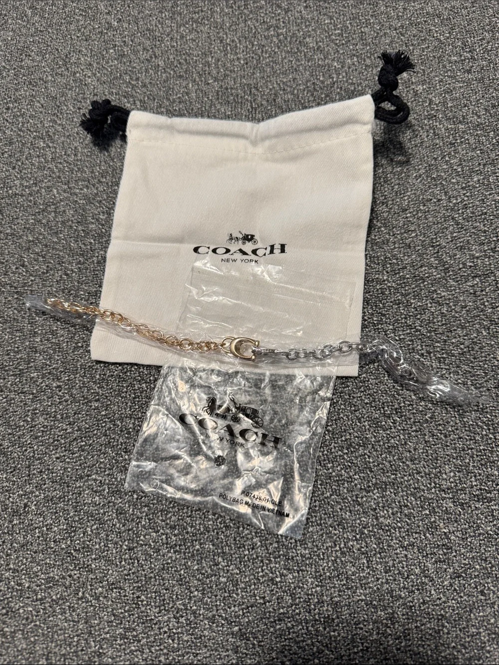 Gold and silver Coach bracelet